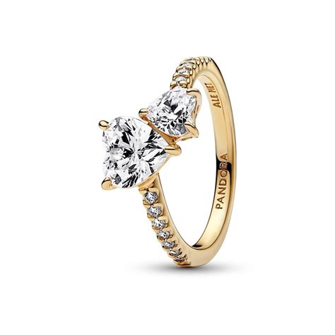Hand-finished in sterling silver, the <strong>ring</strong> features sparkling clear cubic zirconia in a prong setting to elevate the stone from its thin band, which features the <strong>Pandora</strong> logo on the inside the shank. . Gold ring pandora